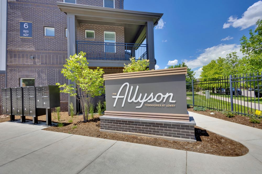 Sign of The Allyson Townhomes at entrance of the community